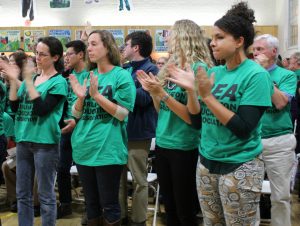 Teachers applaud a speaker during the public comment period at the Burlington School District meeting on Thursday, Oct. 13.