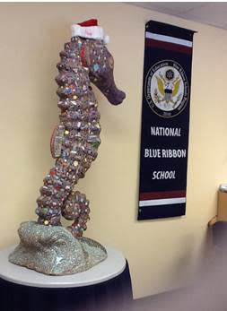 A statue of Seraphina, the mascot of Sanibel, Fl. High School, stands in a hallway at the school. Sanibel is the only high school in the U.S. to share the seahorse mascot with Burlington High School.