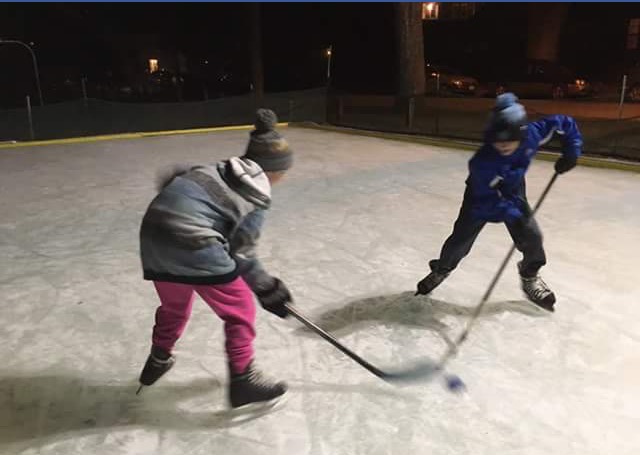 Kids battle for the puck at a pick-up hockey game at Lakeside Park. | Photo: Lakeside Community Rink via Facebook
