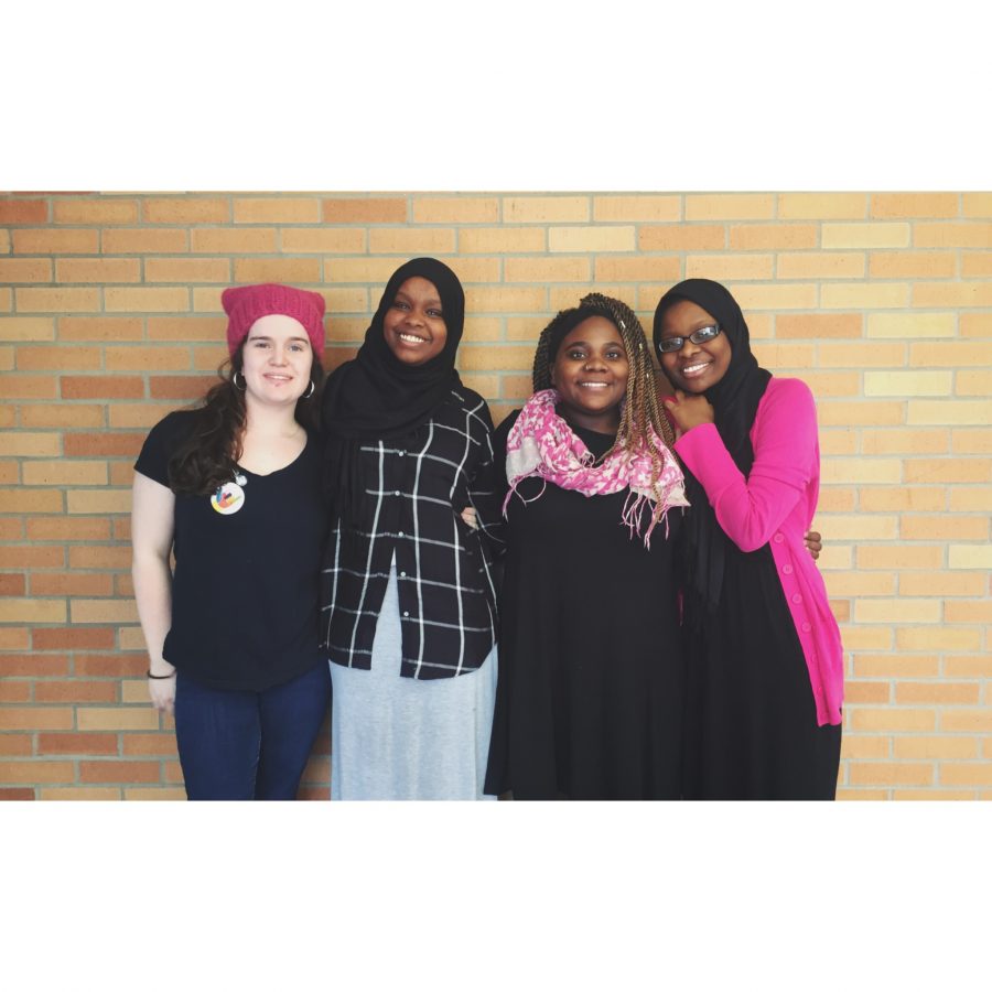 Emma+Chaffee%2C+Balkisa+Abdikadir%2C+Eliza+Abedi+and+Hawa+Adam+pose+for+a+photo+on+Jan.+25.+Students+wore+black+and+pink+to+show+support+for+women%E2%80%99s+rights.+%7C+Photo%3A+OREAD