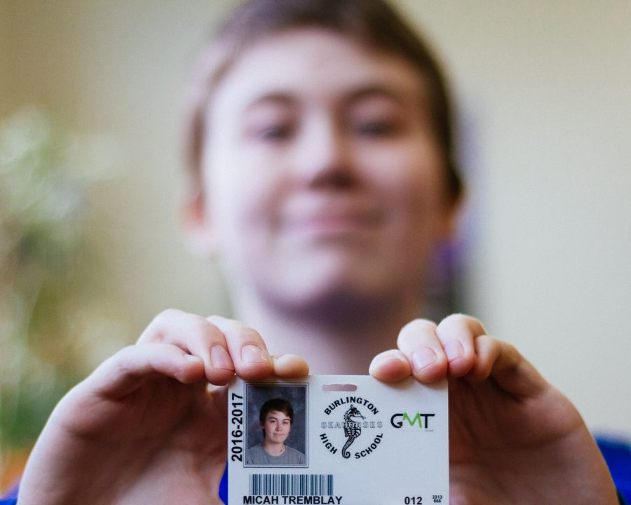Micah Tremblay, a BHS senior and transgender male, holds up his school identification card on Jan. 30. | Photo: Jake Bucci/Register