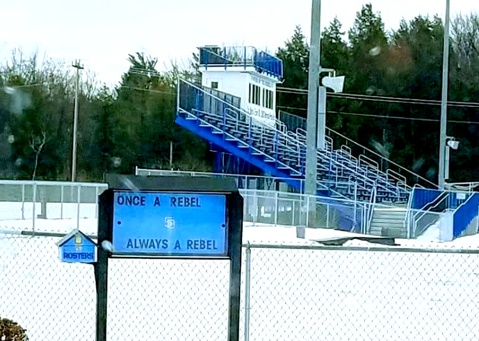 A sign outside the South Burlington High School football field reads Once a Rebel, Always a Rebel, pictured on Feb. 8. The school board voted unanimously to remove the mascot, as ties to the confederate south prompted pressure from students and community members. | Photo Courtesy: Ben Tate