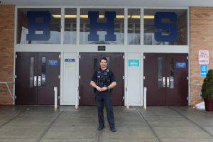 School Resource Officer Brian Difranco stands outside the entrance to the high school on March, 28. | Photo: Alexandre Silberman/Register