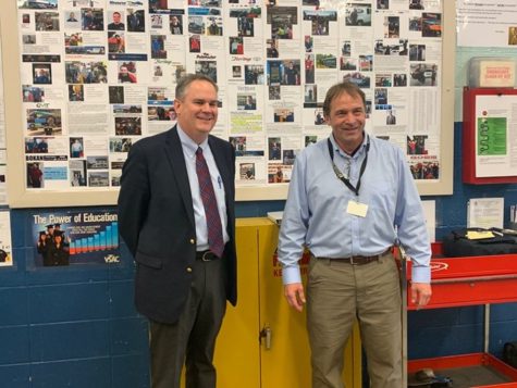Photo: Courtesy of Bob Church//Automotive and Technology Instructor Bob Church and VT Secretary of Education Dan French in front of the BTC wall of fame 