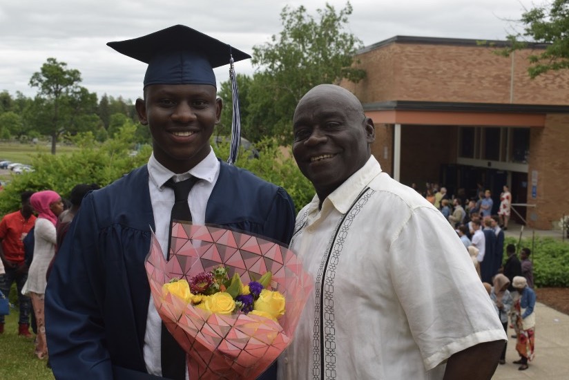 Photo: courtesy of Haji Haji. Cope celebrates with Haji at his 2018 Burlington High School graduation. 