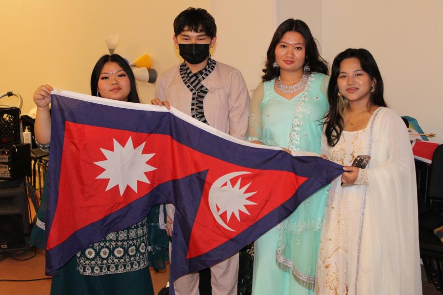 Left to Right: Astha Mangar, Milan Tamang, Menuka Monger, and Preity Mangar with flag. 