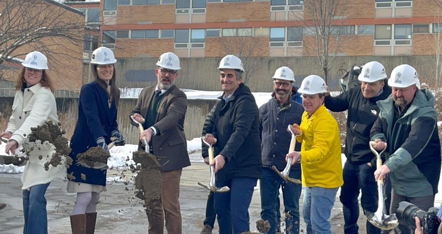 Major Miro Weinberger, Superintendent Tom Flanagan, Board Chair Clare Wool, BEA Union President Beth Fialko-Casey participate in a ceremony to begin the construction of the new high school on Institute Road. 