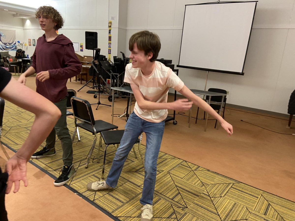 Keats Overman-Smith 26 (Mr. D) and Oliver Kochalka 26 (Mr. Brunner/Chiron) warming up with the rest of the cast of The Lightning Thief.