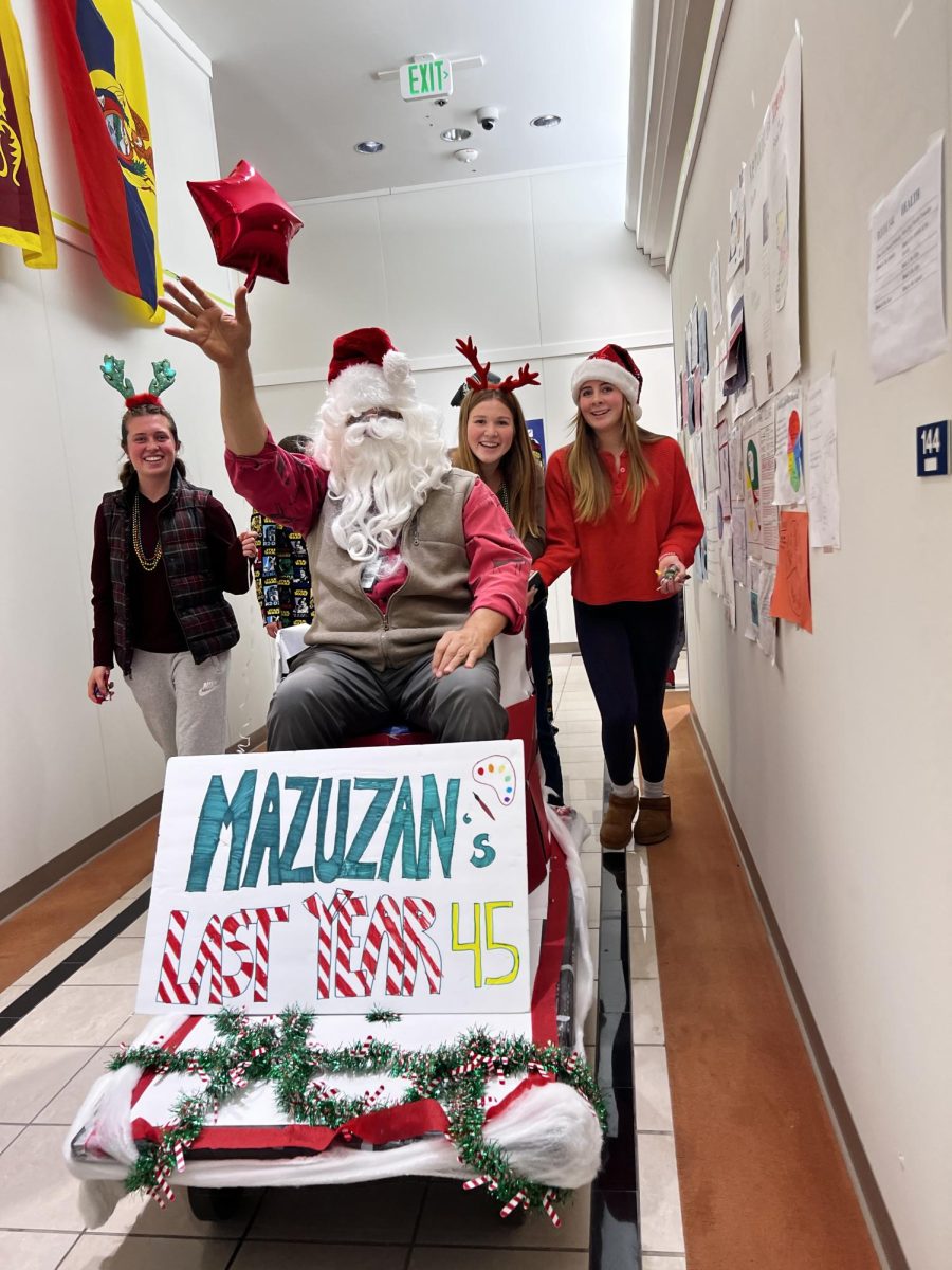 Norra Moody 24 pushes Mr. Mazuzan (Santa) at the end of the parade. 