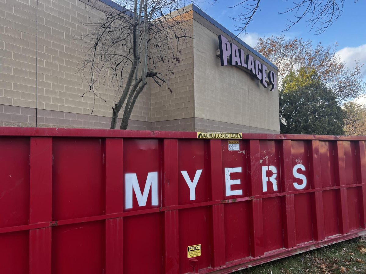 A dumpster sits outside the former Palace 9 movie theater. 