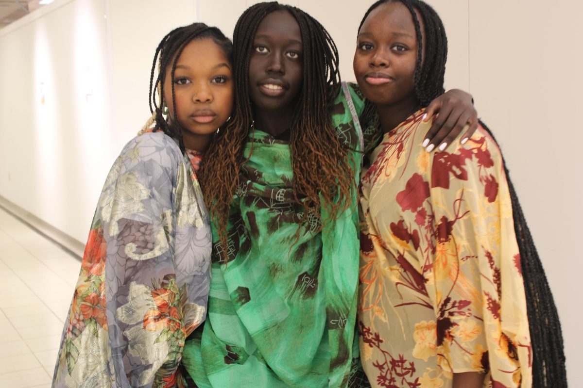 Kali Ali 26, Nyankor Ateny 26, and Nasra Hassan 26 right after the Culture Day fashion show. 