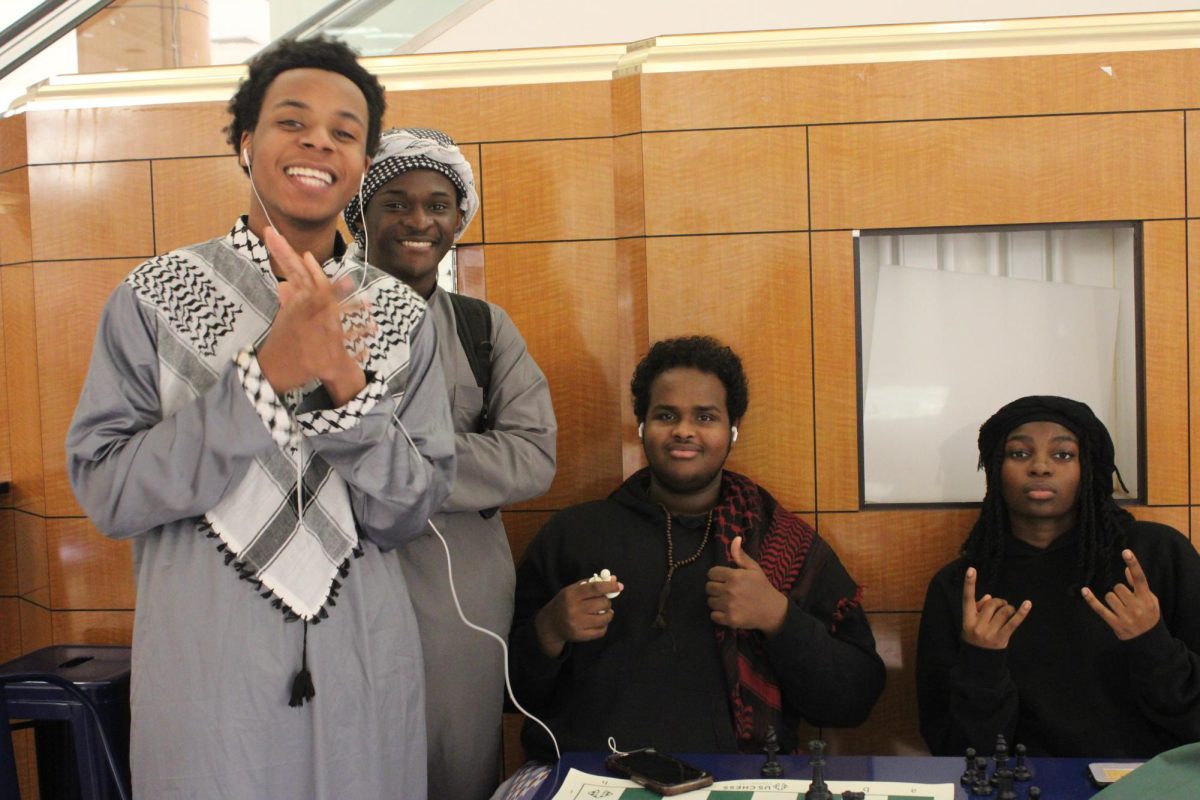 Osman Siidi 26, Ali Ali 25, Hilowle Ibrahim 24, Hawa Mubarak 25 playing chess during Culture Day.