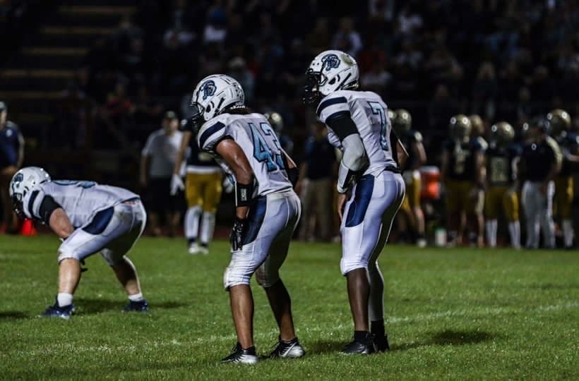 Morgan (43) and Diawara (7) line up prior to the snap at the game against Essex