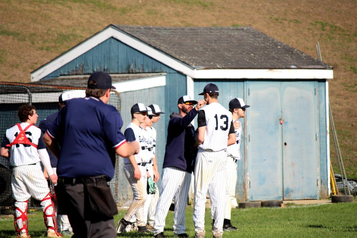 Coach Cagney talking to a player after a bad inning 