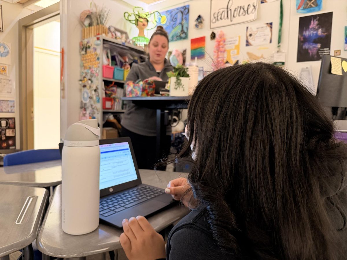Reading Specialist Lauren Morse working one-on-one with a student.