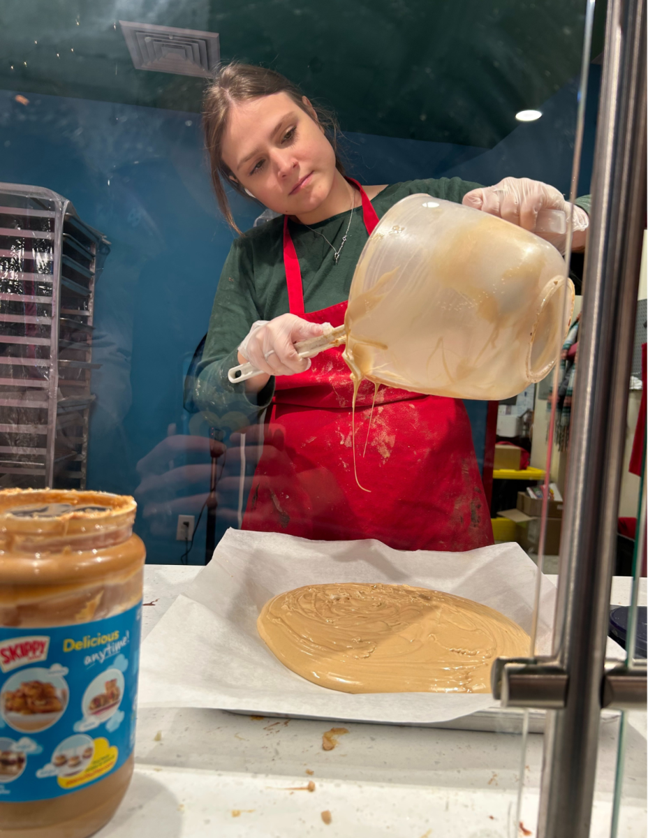 Ana Ferdock making fudge in the back of Whizbangs