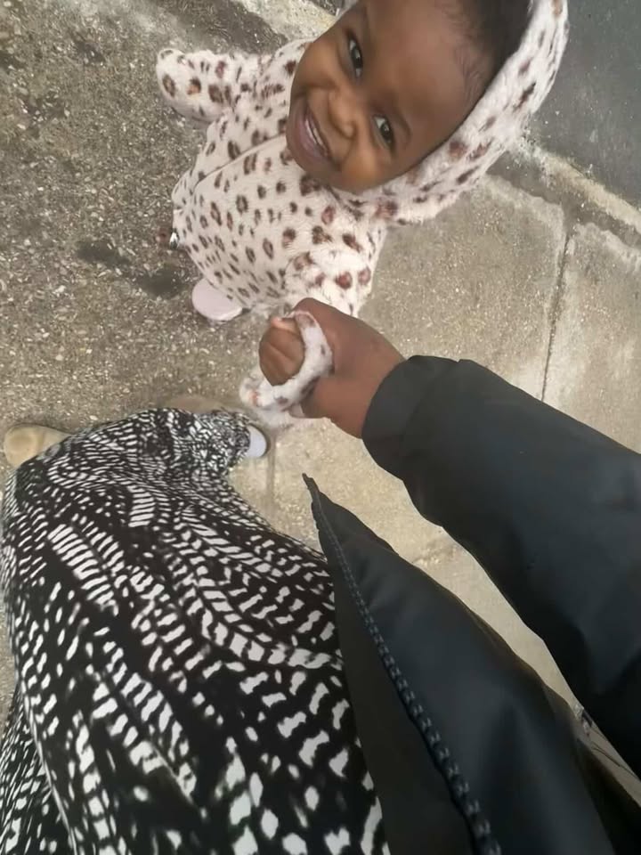 Koleta Morina ‘27 holding her sibling’s hand. Morina said she finds it hard to get the required 40 hours of community service because she has to babysit almost every night. 
